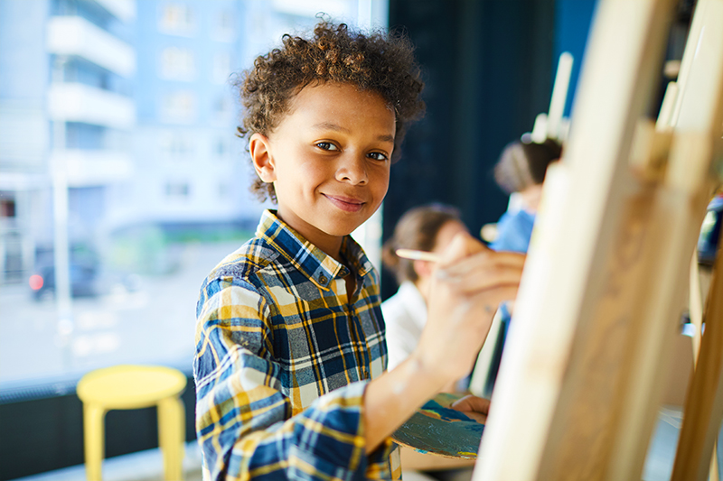 young boy painting