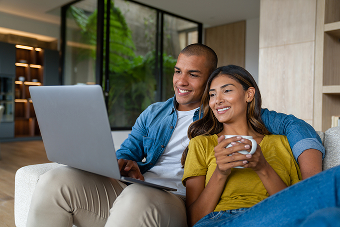 Couple using laptop