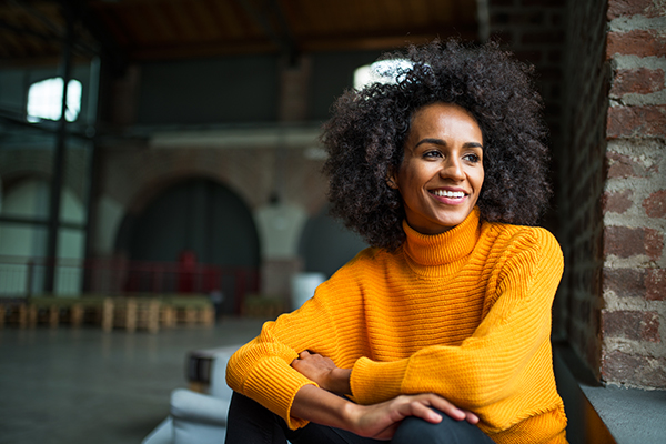 women in yellow sweater